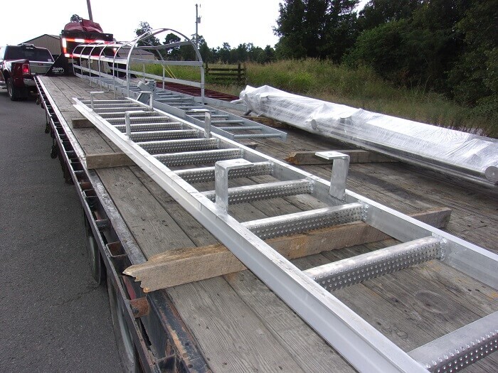 Caged ladder on a trailer