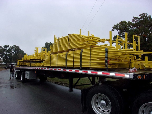 metal panels strapped on the bed of a semi